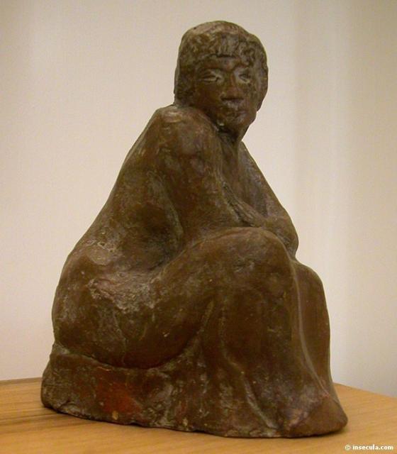 1902 Femme assise